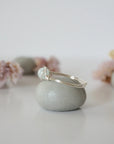 Side angle of silver aquamarine ring, artisan wire wrapped, minimalist design