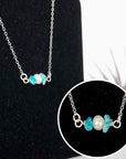 Raw turquoise pearl bar pendant close up detail handmade sterling silver wire