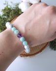 White howlite, amethyst, and amazonite beaded bracelet shown on a model’s wrist, stretch fit, calming crystal jewelry for women