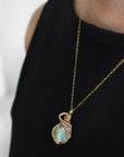 Raw opal necklace in 14k gold filled on a female model. Handcrafted October birthstone jewelry for women by Designs by Nature Gems.